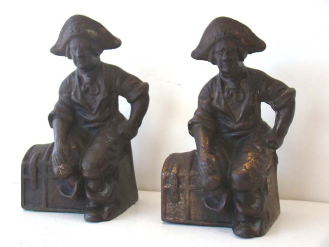 A pair of Pirate sitting on a treasure chest antique bookends circa 1900